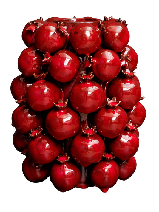 High vase of pomegranates