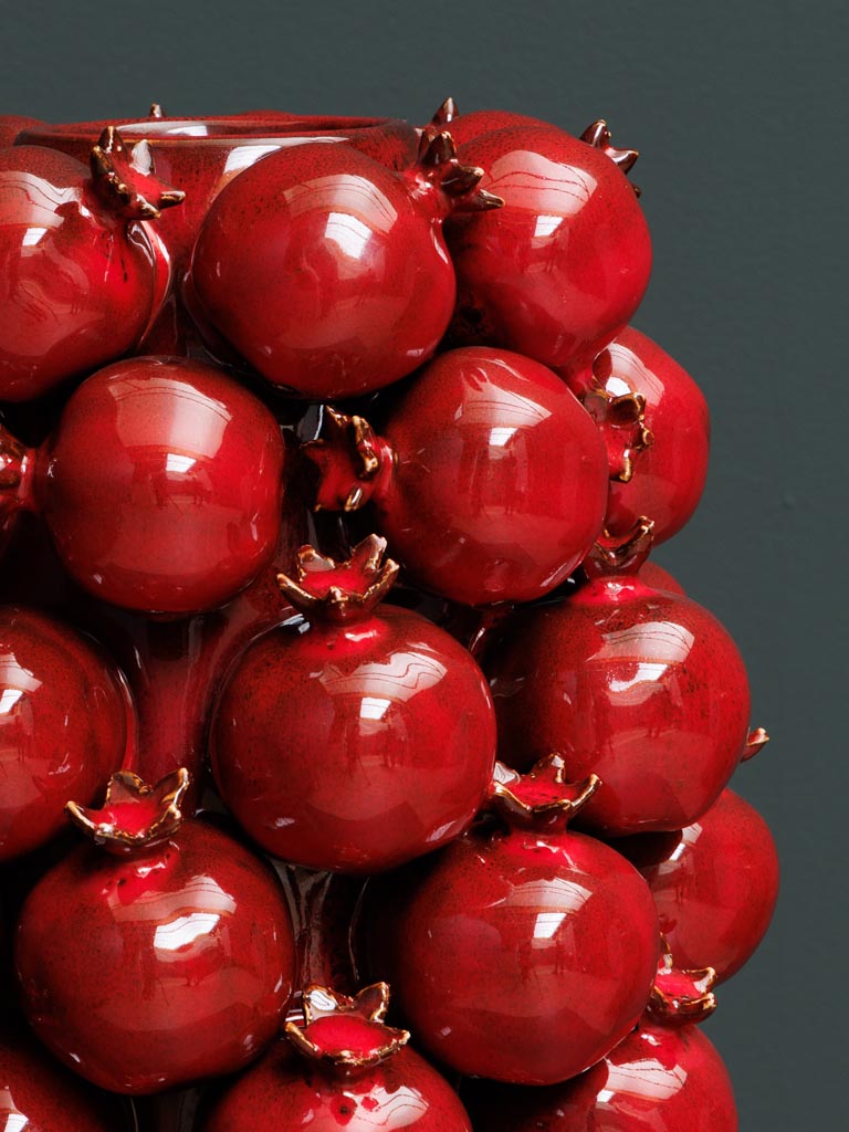 High vase of pomegranates